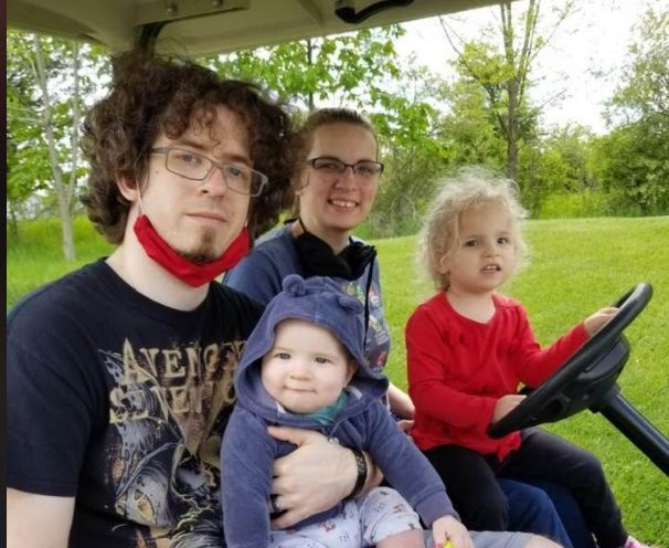family on golf cart
