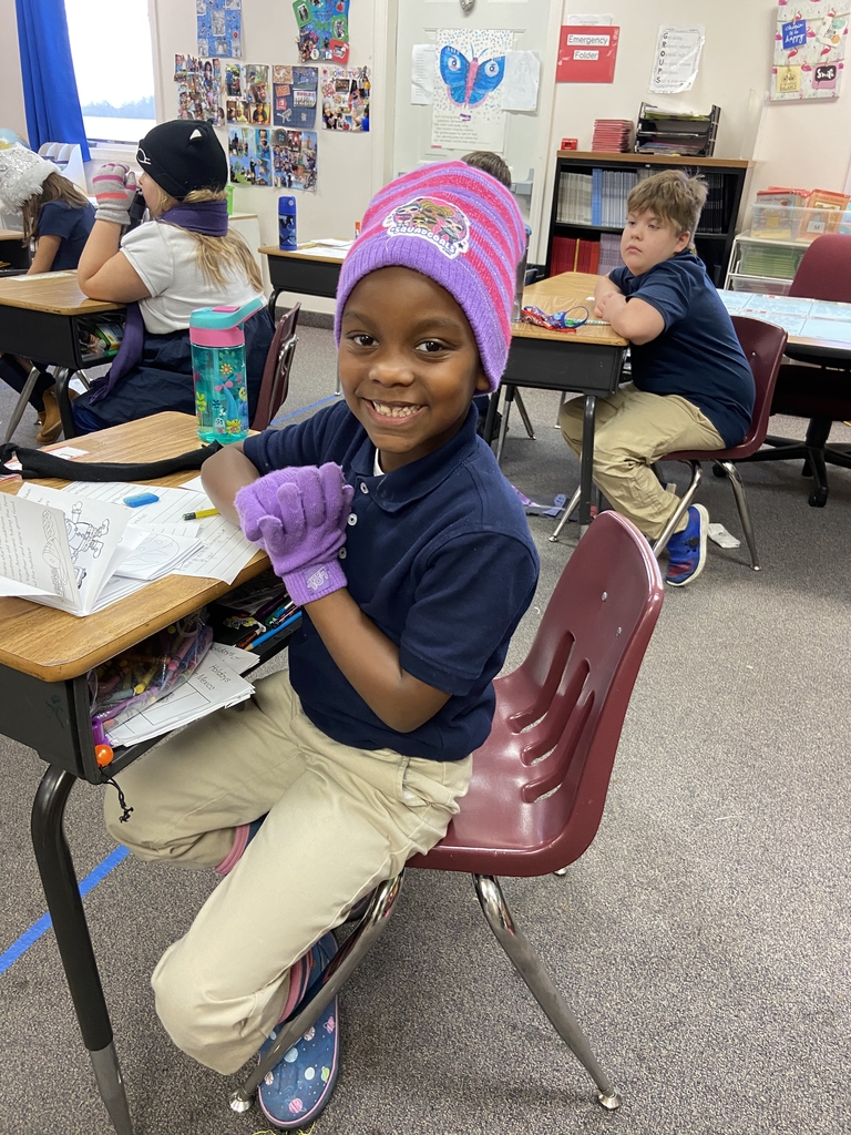 Student with hats and gloves