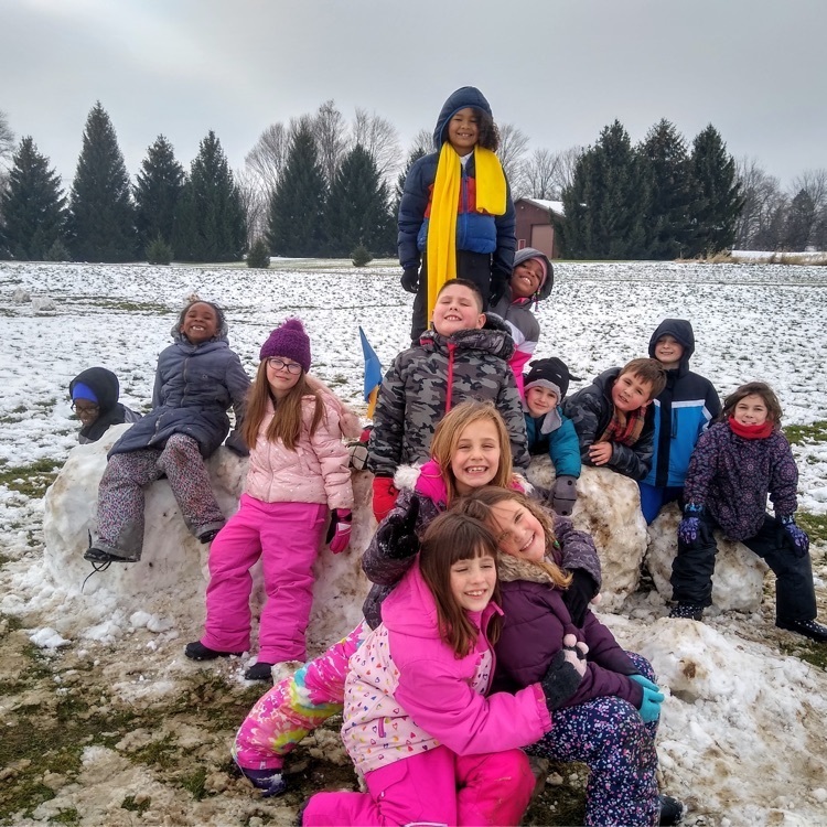 group of kids in the snow